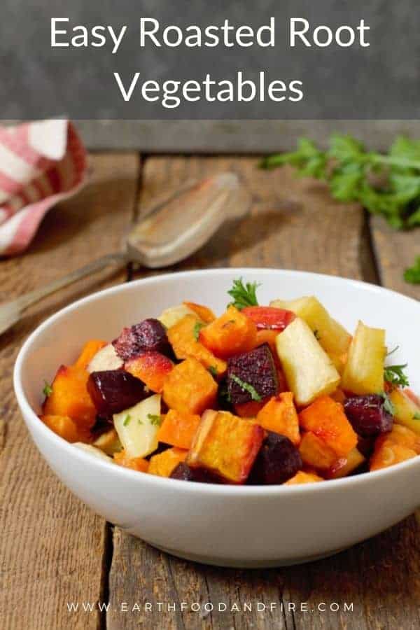 oven roasted root vegetables in a white bowl with Pinterest text overlay