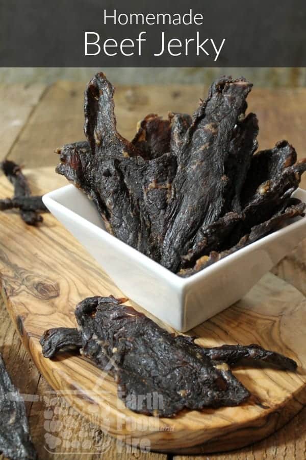 homemade oven dried beef jerky in a square white serving dish