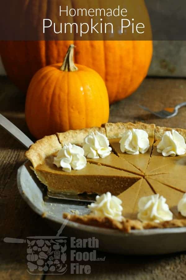 pinterest image of a sliced homemade pumpkin pie on a wooden table in front of small pumpkins.