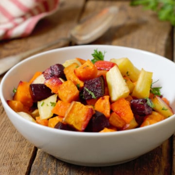 oven roasted root vegetable medley in a white porcelain bowl